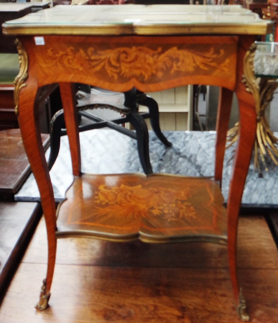 Appraisal: An early th century marquetry inlaid gilt metal mounted Kingwood