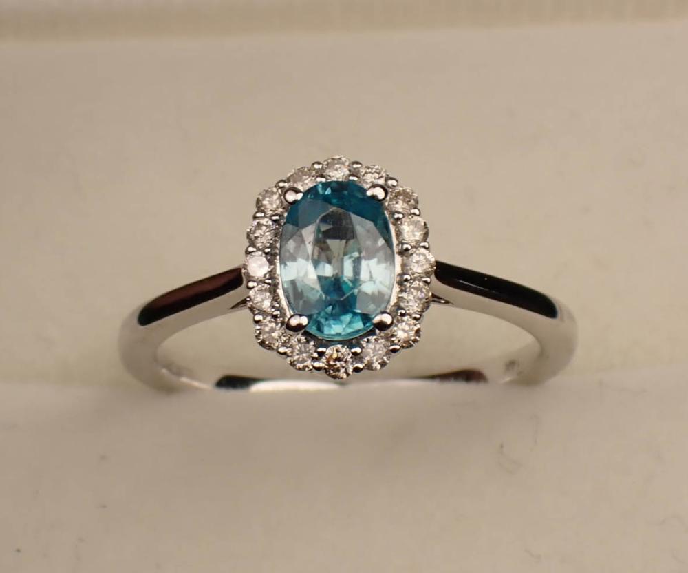 Appraisal: BLUE ZIRCON DIAMOND HALO AND FOURTEEN KARAT GOLD RING The