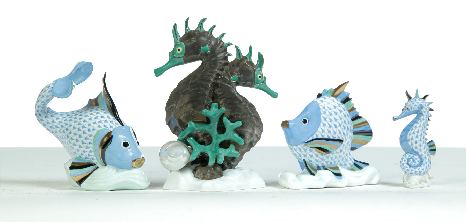 Appraisal: FOUR PIECES OF HEREND HAND PAINTED AQUATIC FIGURINES INCLUDING SEA