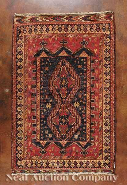 Appraisal: A Russian Sumak Rug red ground geometric polychrome motifs ft