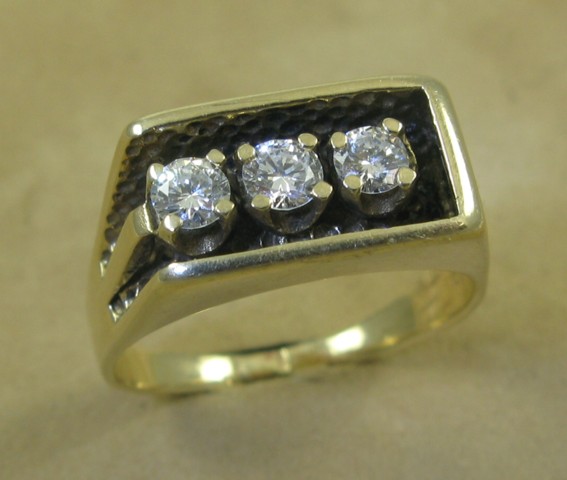 Appraisal: MAN'S DIAMOND AND TEN KARAT GOLD RING set with three