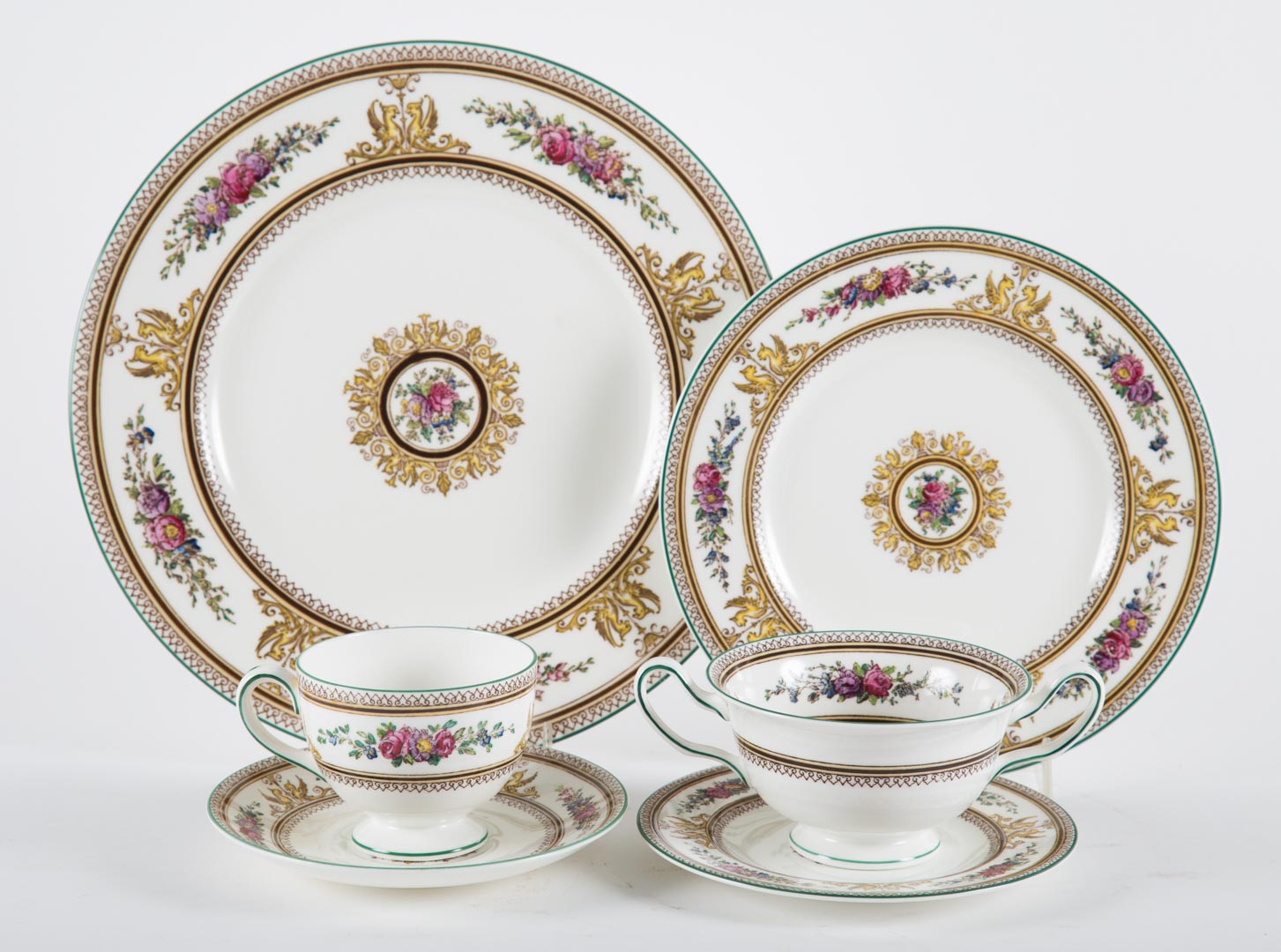 Appraisal: Wedgwood china partial dinner service in the Columbian pattern approx