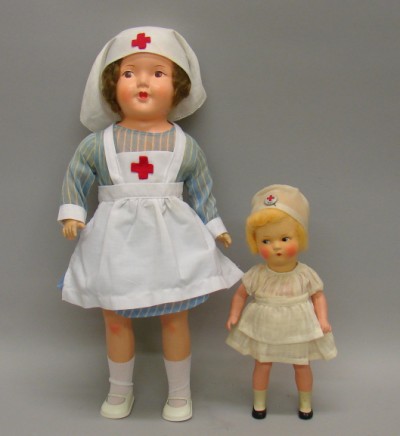 Appraisal: Pair of nurse dolls Germany Patsy type papier mache doll