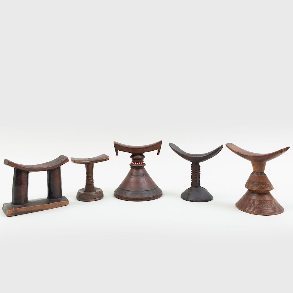 Appraisal: Group of Five African Wooden Headrests Including examples from Guinea