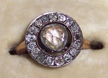 Appraisal: A diamond cluster ring the central rose cut stone with