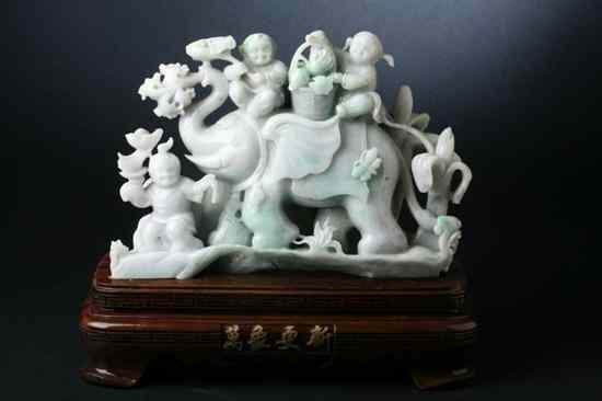 Appraisal: CHINESE LAVENDER AND APPLE GREEN JADEITE FIGURAL GROUP Carved to