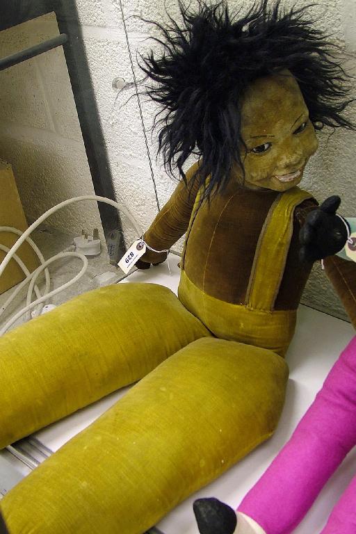 Appraisal: Early th century stuffed toy of a negro girl with