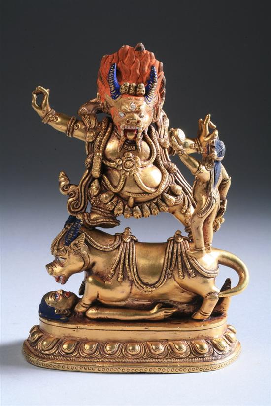 Appraisal: TIBETAN GILT BRONZE FIGURE OF YAMA AND YAMI The Dharmapala