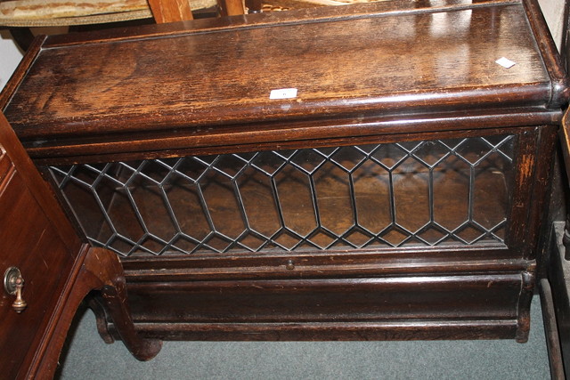 Appraisal: AN EDWARDIAN OAK UP AND OVER BOOKCASE enclosed by single