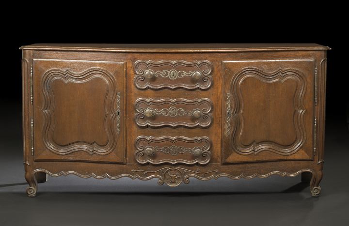 Appraisal: Provincial Louis XV-Style Oak Buffet late th century the rounded