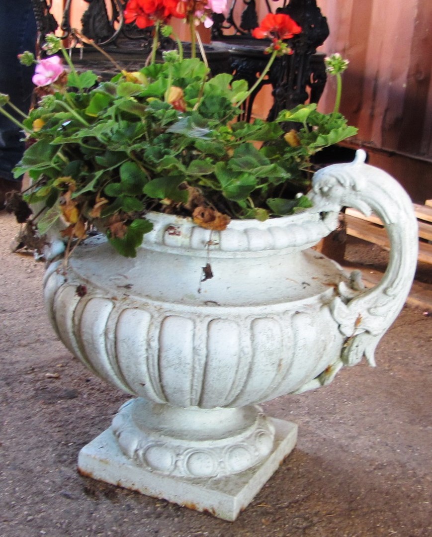 Appraisal: A green painted cast iron two handled jardiniere with semi