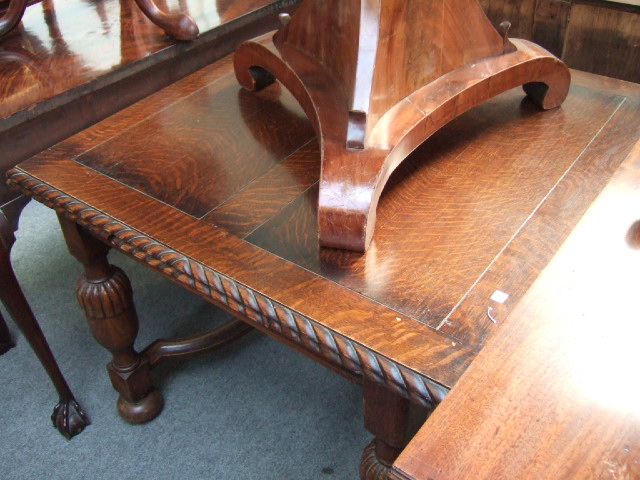 Appraisal: A mid th century oak drawer leaf dining table the