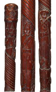 Appraisal: Military Folk-Art Cane Ca A carved one-piece cane with various