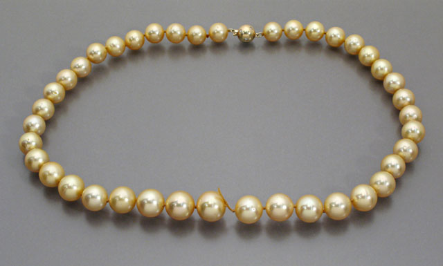 Appraisal: GOLDEN SOUTH SEA PEARL NECKLACE strung with round round graduated