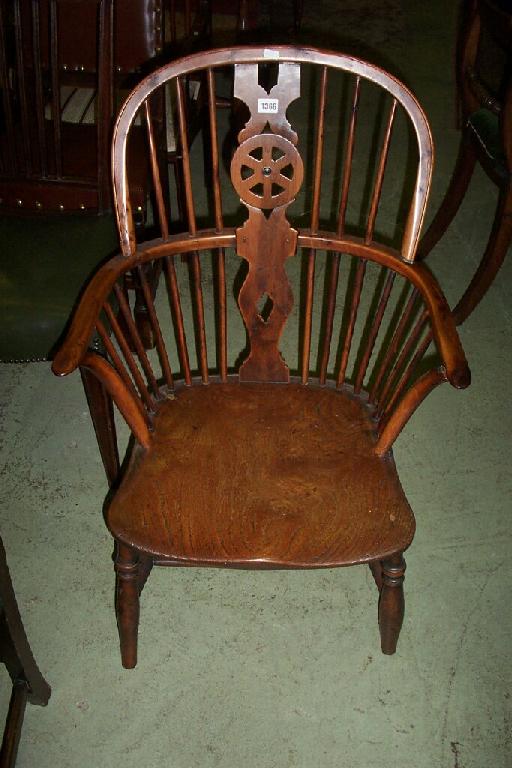 Appraisal: A Georgian Windsor wheel back elbow chair with hooped and