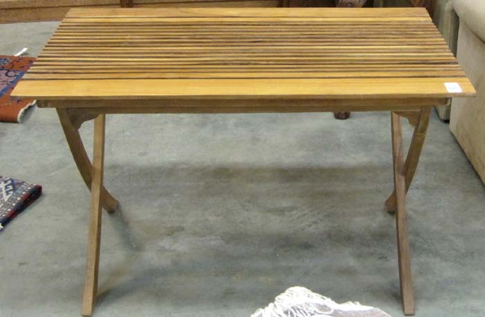 Appraisal: TEAK GARDEN DINING TABLE having a rectangular slat top over