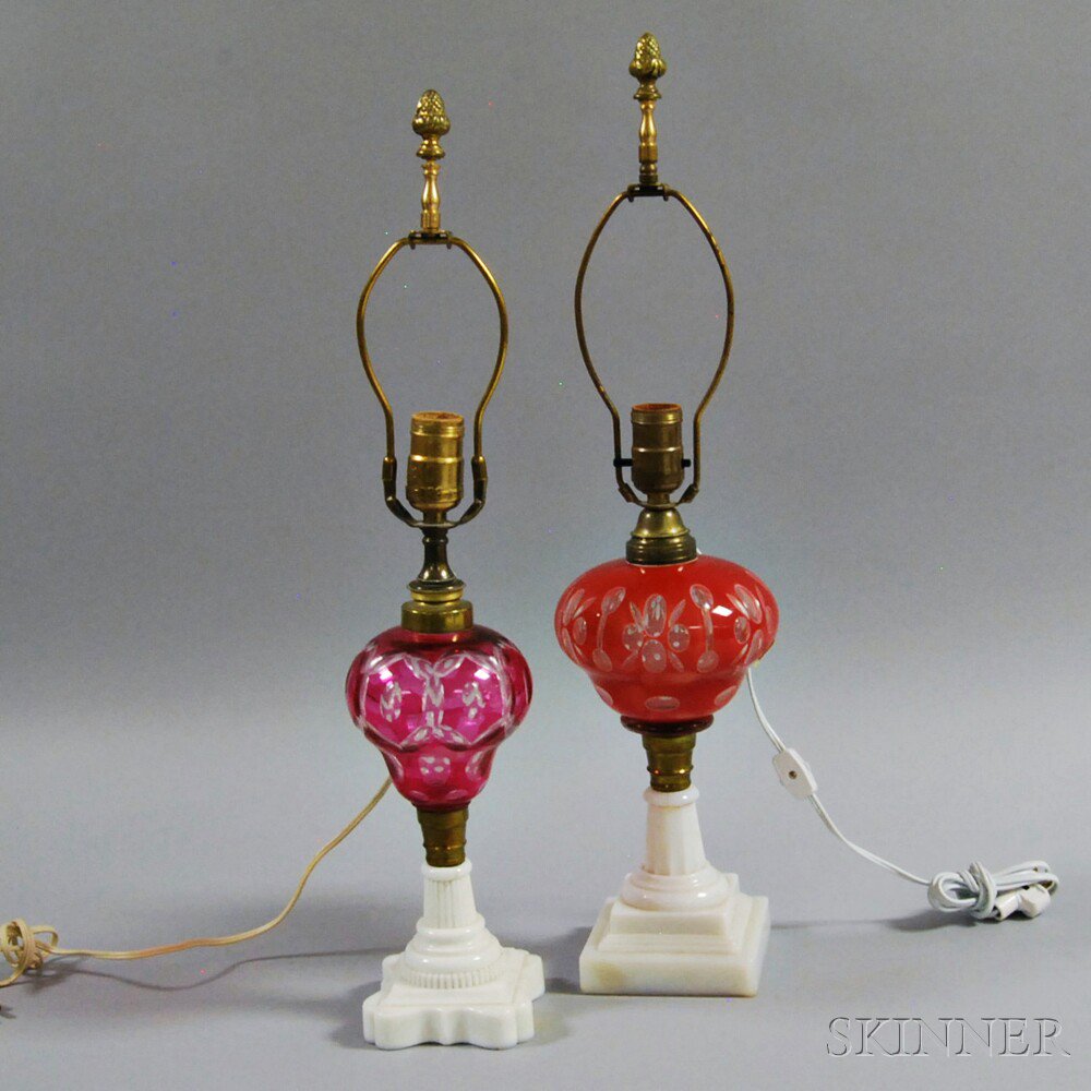 Appraisal: Two Cranberry Cut-to-clear Oil Lamps both raised on opaque glass