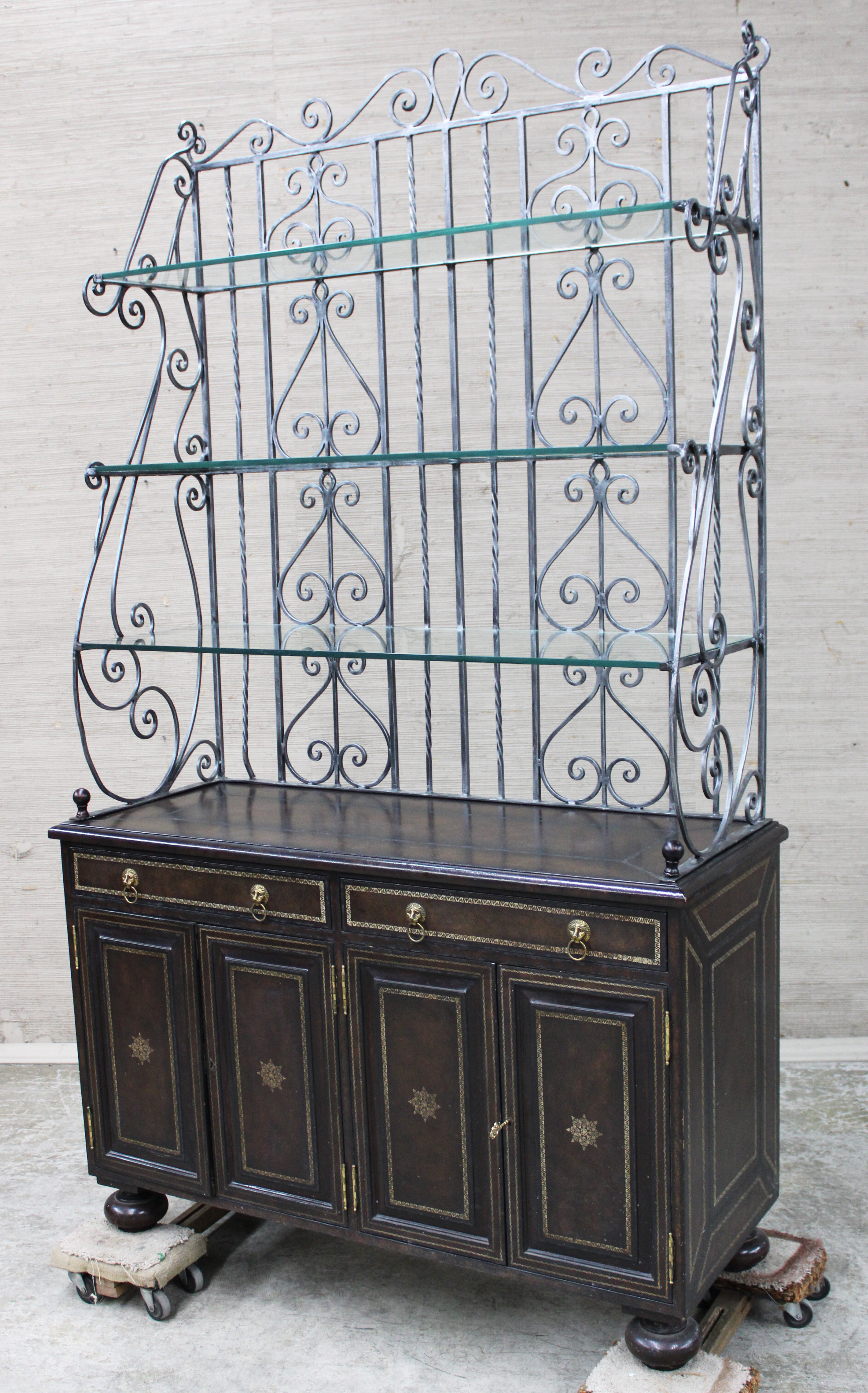 Appraisal: MAITLAND SMITH Maitland Smith wrought iron bakers rack with embossed