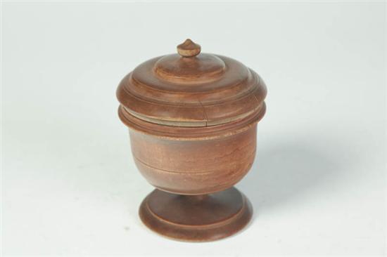 Appraisal: PEASEWARE FOOTED URN Ohio late th-early th century hardwood Lid