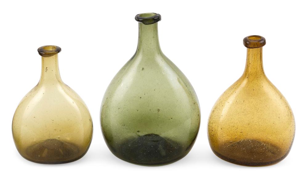 Appraisal: THREE BLOWN GLASS CHESTNUT BOTTLES NEW ENGLAND LATE TH CENTURY