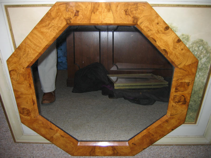 Appraisal: MANNER OF MILO BAUGHMAN Olive burl framed octagonal wall mirror