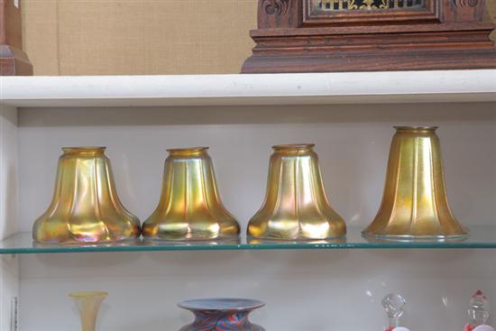 Appraisal: FOUR ART GLASS SHADES Iridescent gold finish with ribbed bodies