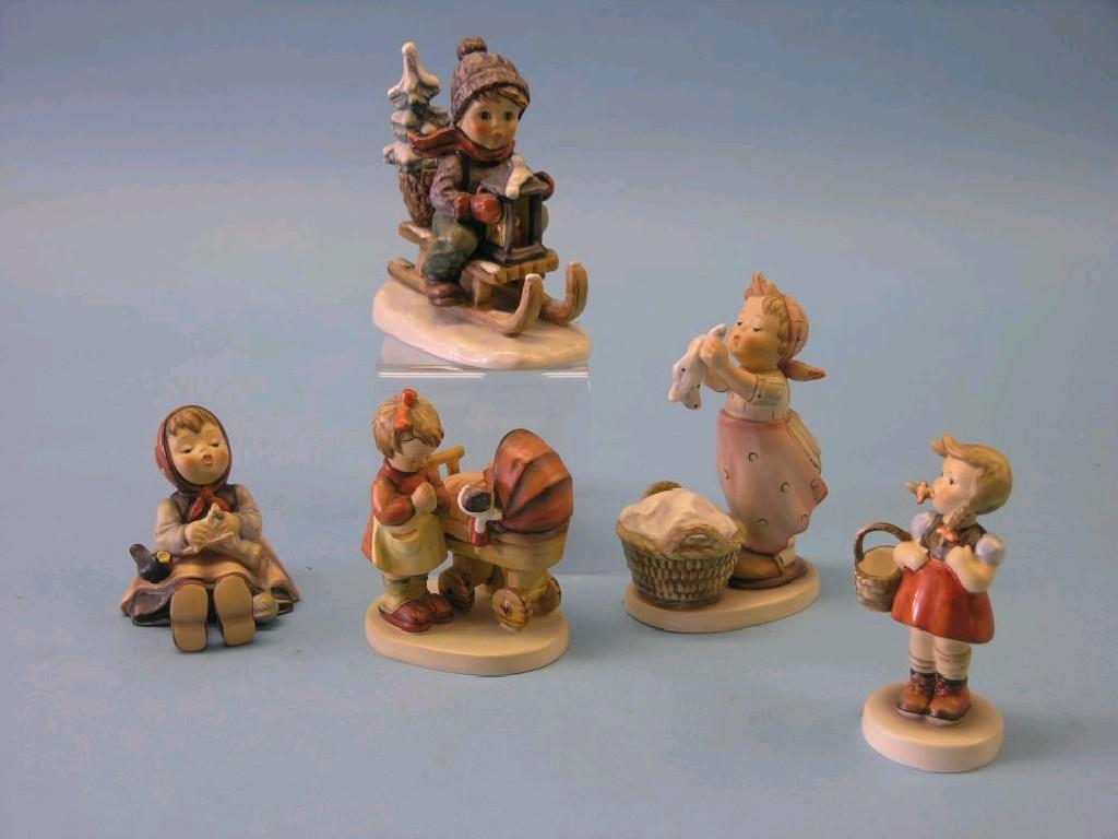 Appraisal: Five Goebel Hummel figures including boy on sledge