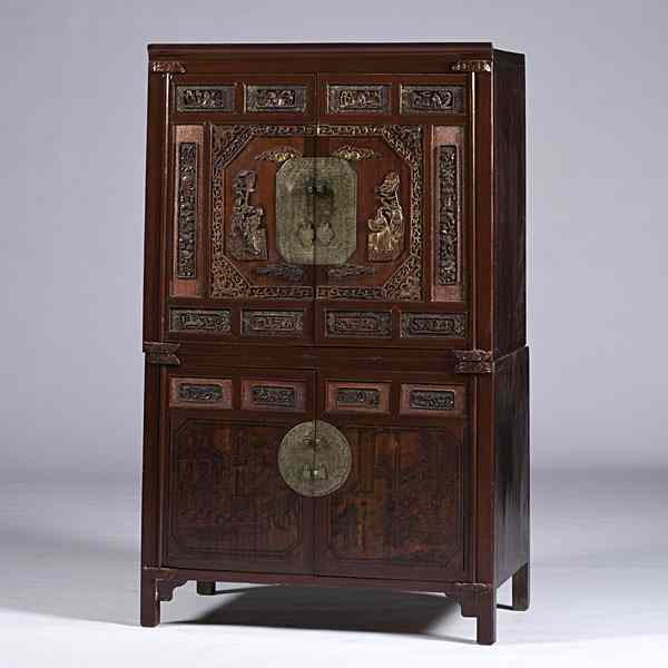 Appraisal: Chinese Carved and Painted Tansu Chinese A red elmwood tansu