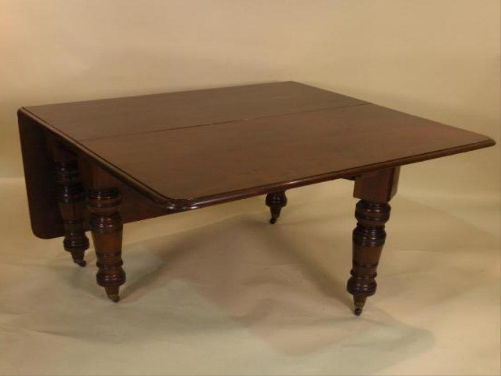 Appraisal: A Victorian mahogany drop leaf table the rectangular top with