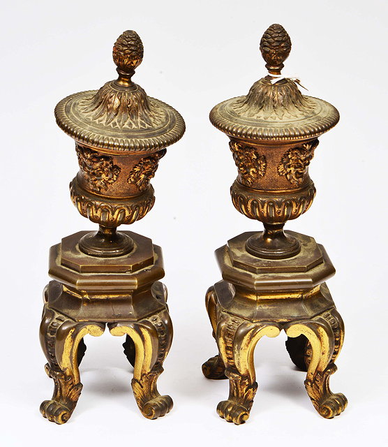 Appraisal: A PAIR OF GILT METAL URN FINIALS standing on octagonal