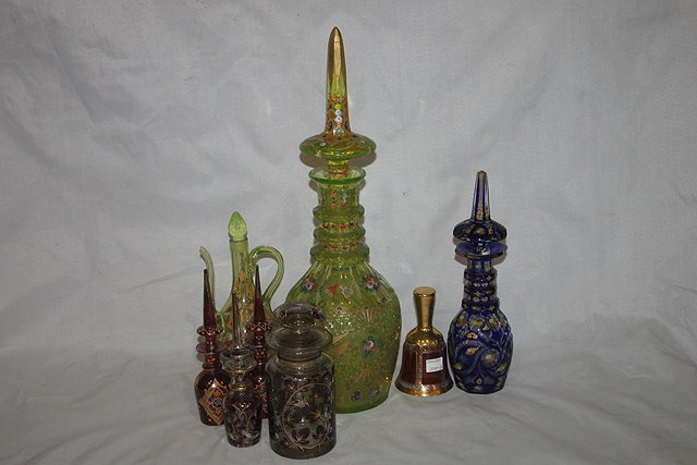 Appraisal: A BOHEMIAN GREEN GLASS DECANTER with tall stopper cm an