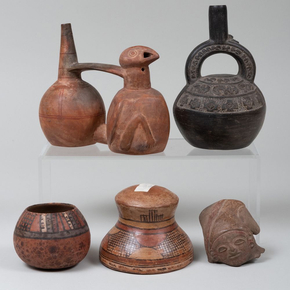 Appraisal: Four Pre-Columbian Style Pottery Vessels and a Sculpture Fragment The