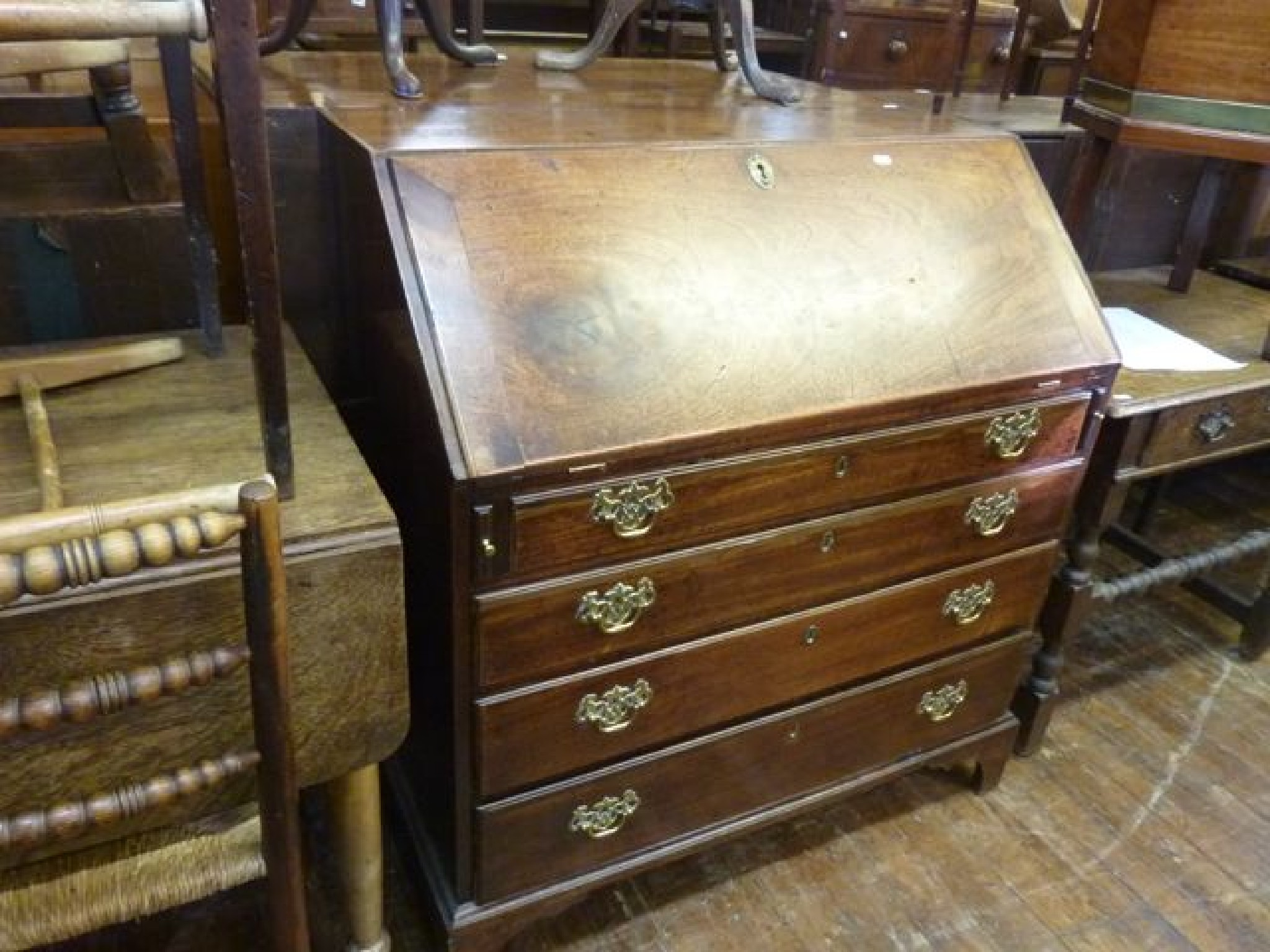 Appraisal: A mid Georgian period mahogany bureau of four long graduated