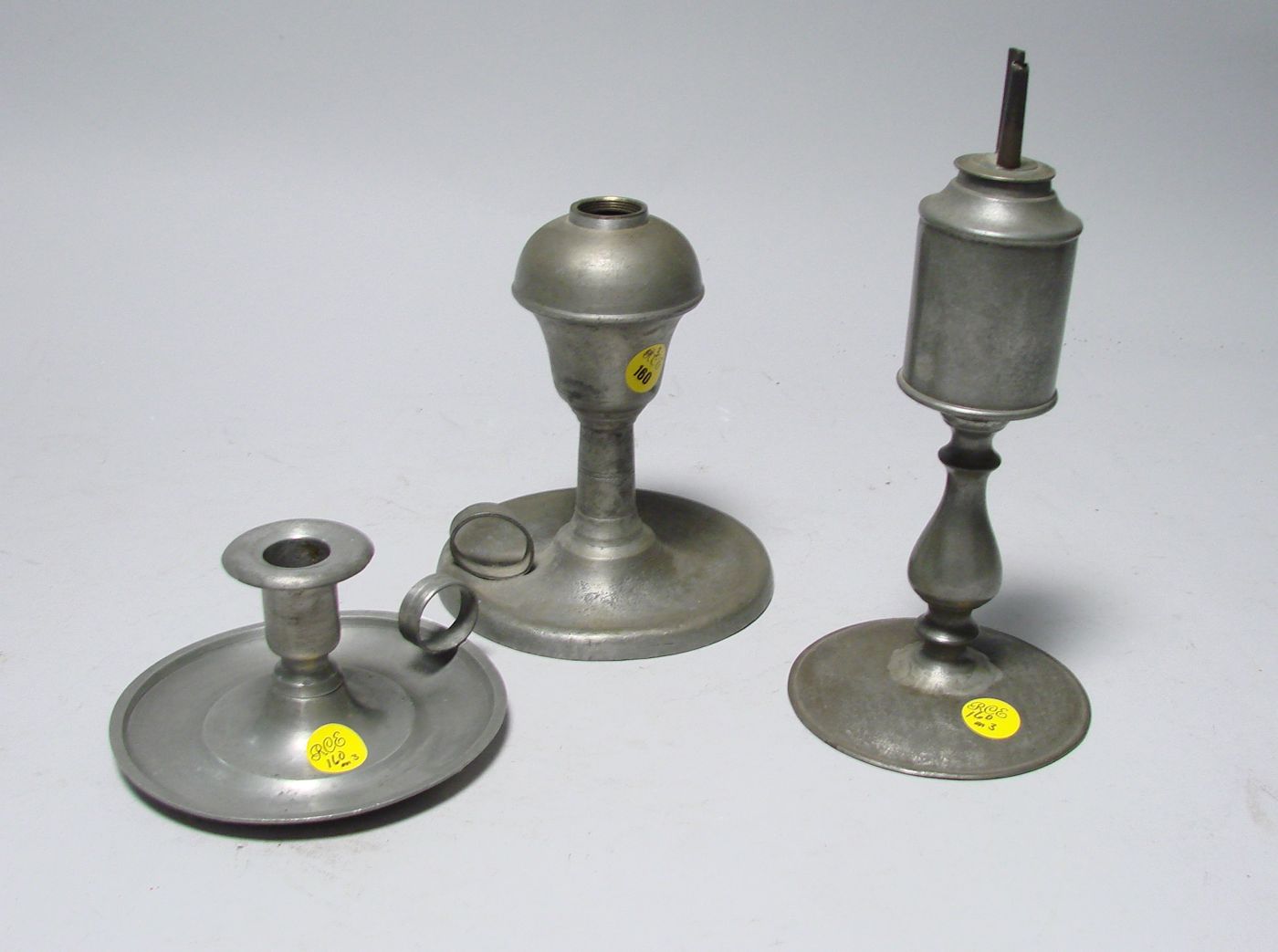 Appraisal: THREE ANTIQUE PEWTER ITEMS American two-burner fluid lamp repaired circa