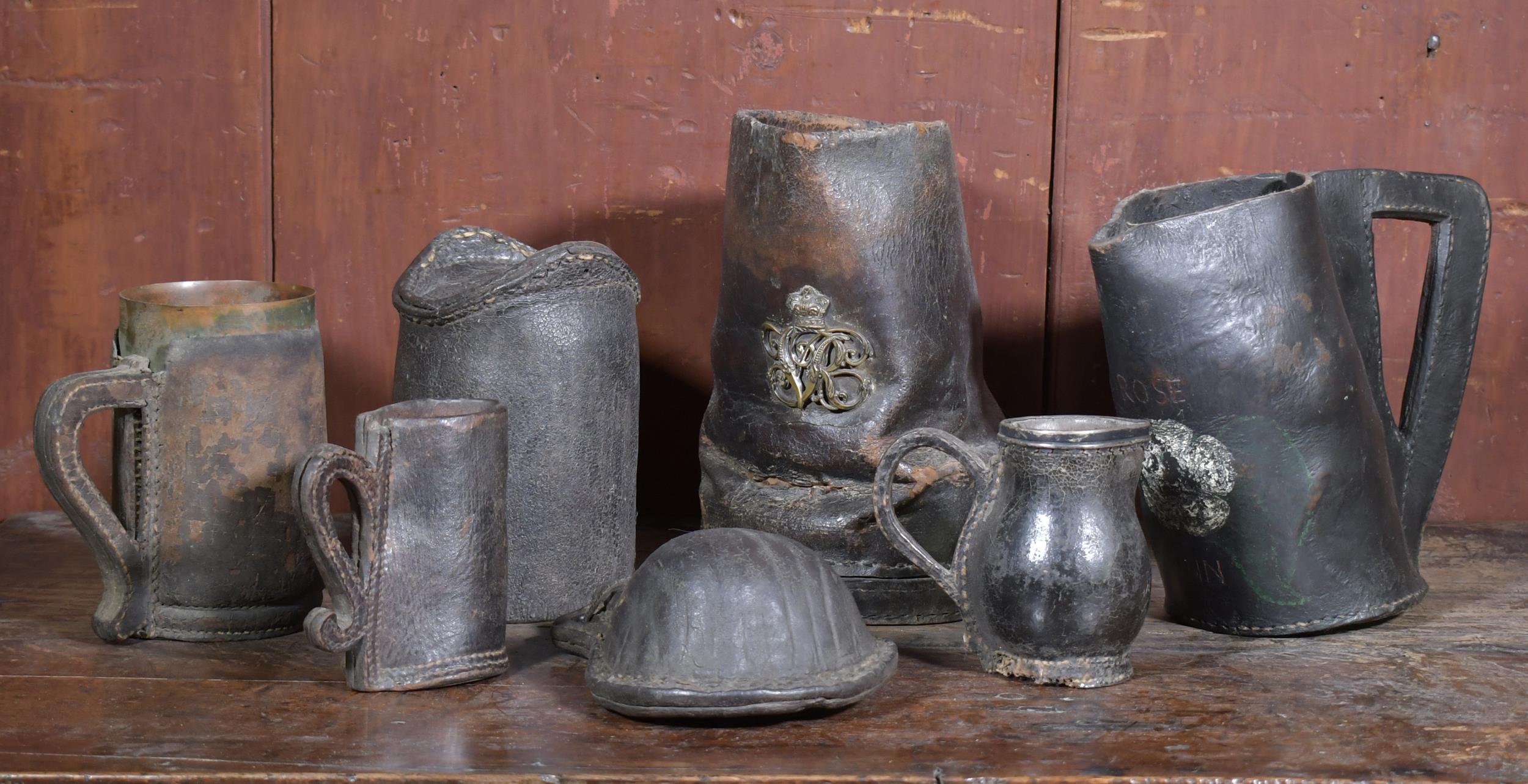 Appraisal: COLLECTION OF EARLY LEATHER VESSELS SEVEN PCS An assortment of