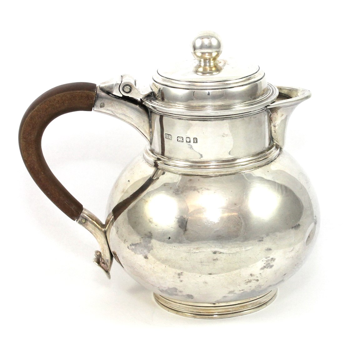 Appraisal: A silver hinge lidded milk jug of Queen Anne baluster