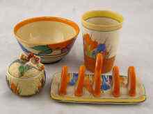 Appraisal: Clarice Cliff - a crocus pattern toastrack crocus beaker crocus