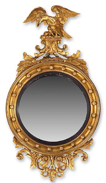 Appraisal: The circular convex mirror plate within a circular frame mounted