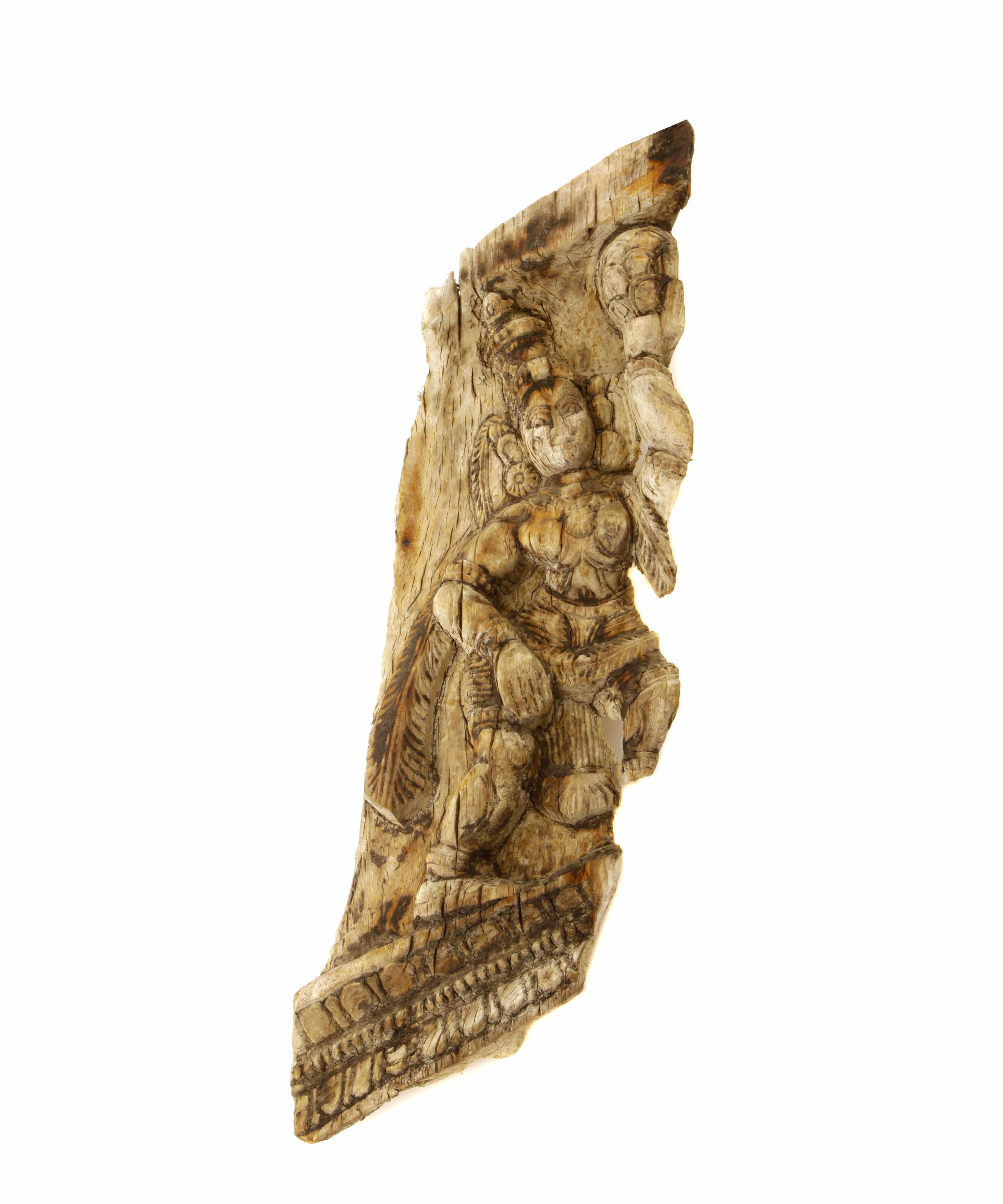 Appraisal: A carved figure of a deity height in length in