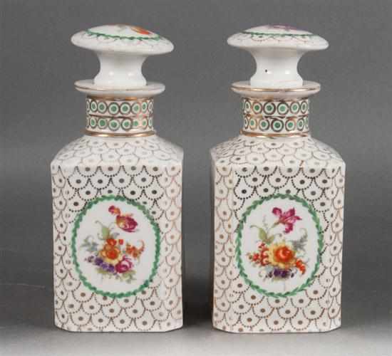 Appraisal: Pair of French parcel-gilt and floral decorated porcelain scent bottles