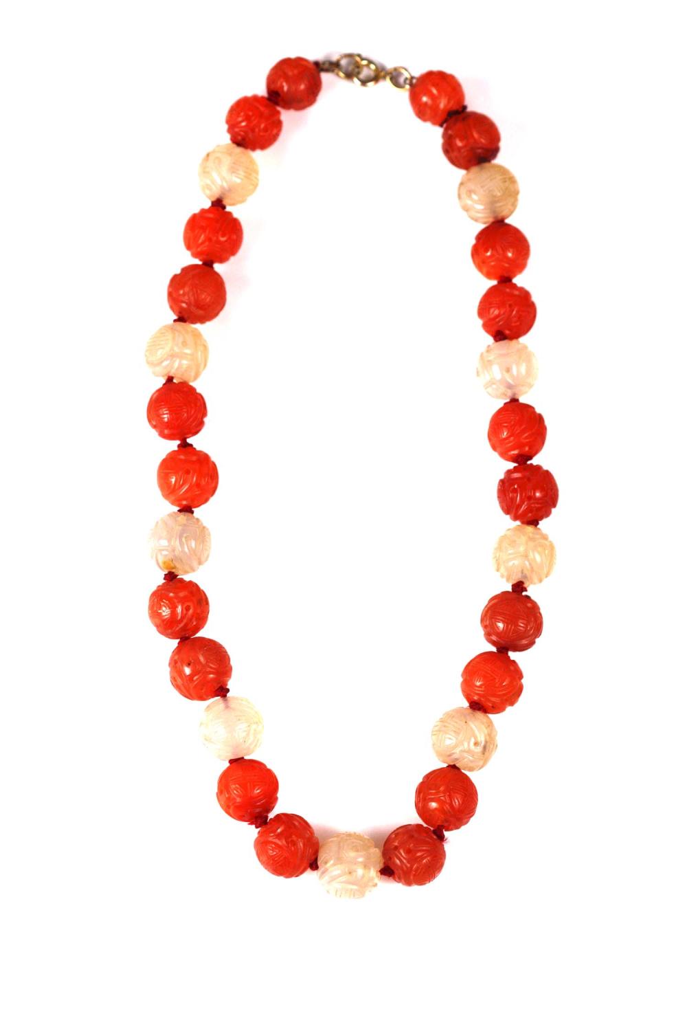 Appraisal: CHINESE CARNELIAN AND WHITE JADE BEAD NECKLACEThe beads carved with