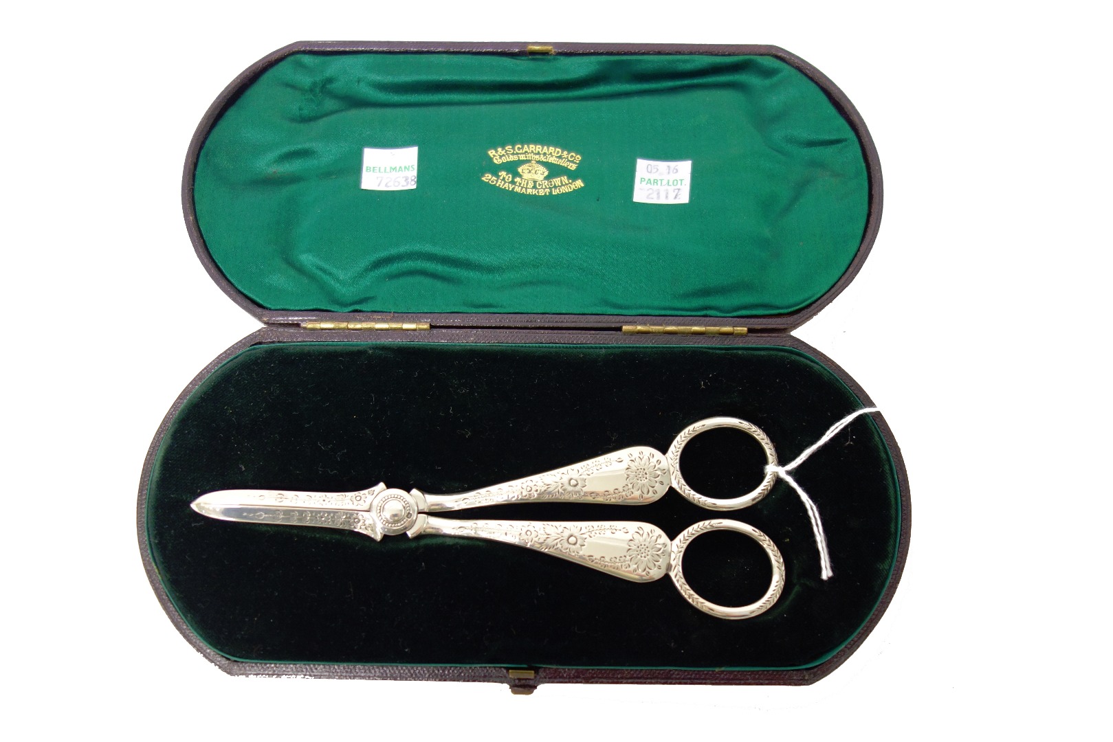 Appraisal: A pair of silver grape scissors with floral and foliate