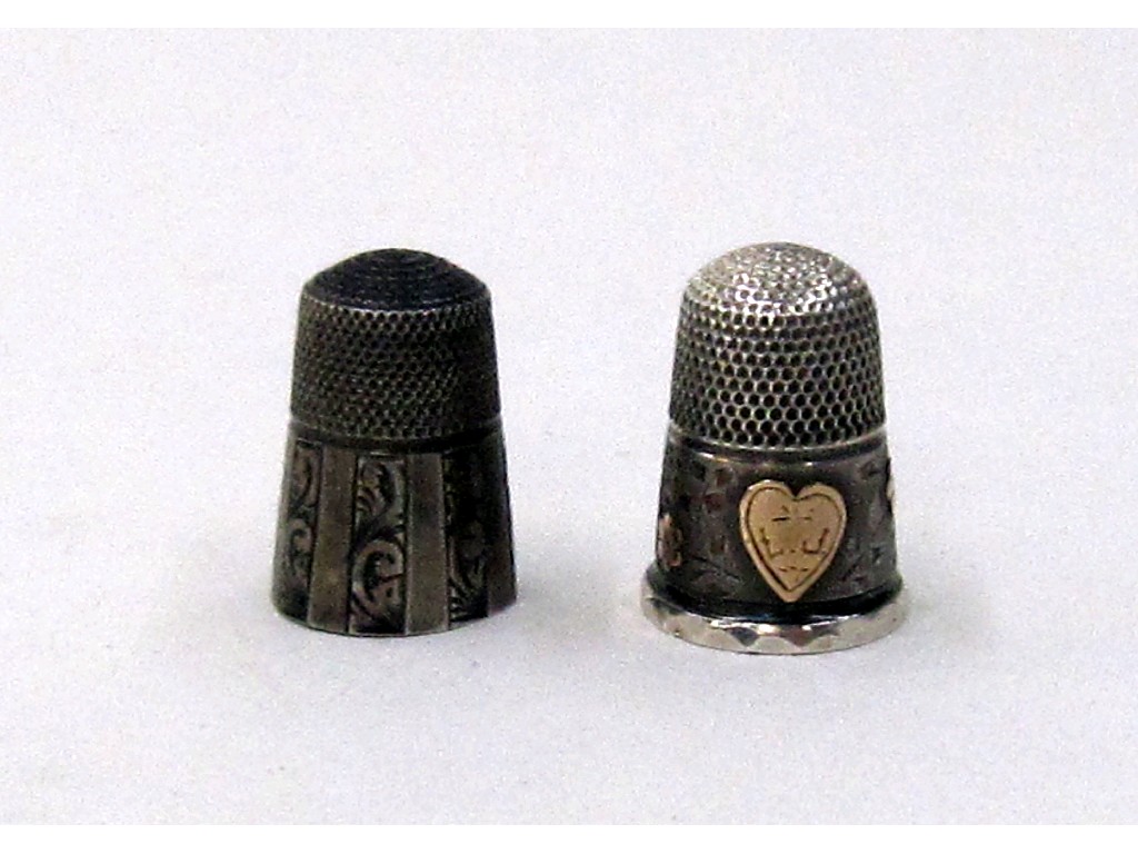 Appraisal: Lot comprising two fancy silver thimbles