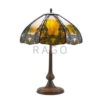 Appraisal: HANDEL Table lamp its faceted shade with enameled overlay of