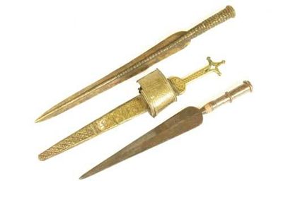 Appraisal: An eastern dagger with steel blade and pierced brass handle