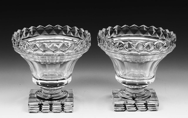 Appraisal: A pair of English glass pedestal saltseach on a square