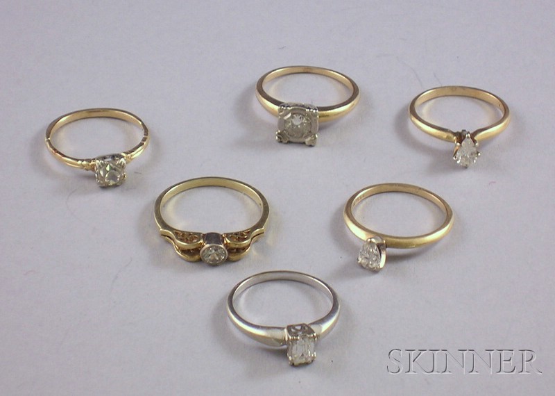 Appraisal: Five Gold and Diamond Solitaire Rings together with one gold