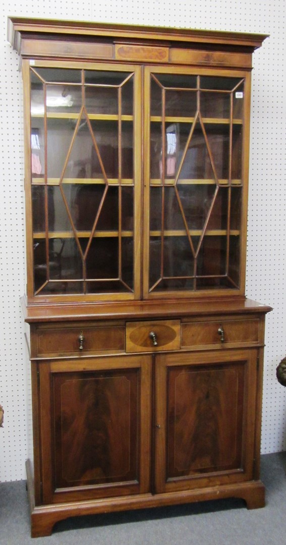 Appraisal: A late th century inlaid mahogany bookcase cabinet the pair