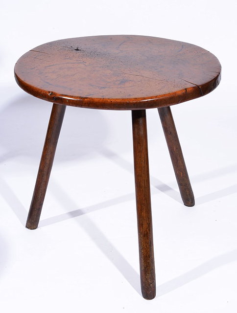 Appraisal: AN ANTIQUE FRUITWOOD CIRCULAR CRICKET TABLE on oak supports cm