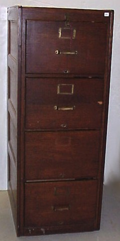 Appraisal: Oak four-drawer filing cabinet with paneled sides possibly made by